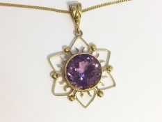 An Amethyst Pendant, set in 9ct yellow gold, fashioned as a Sun. On 9ct gold chain. Total weight 9.