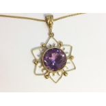 An Amethyst Pendant, set in 9ct yellow gold, fashioned as a Sun. On 9ct gold chain. Total weight 9.