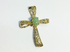 An Openwork cross in 9ct gold, set with a jade cabochon. 26mm high, total weight 1.37 grams.