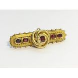 A Victorian Ruby Cannetille Brooch, set in 15ct gold, ETCW 1 ct. Total weight 7.25 grams.