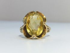 A Citrine ring set in 9ct gold, citrine ETW 4.5 cts. Ring size M, total weight 3.86 grams.