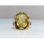 A Citrine ring set in 9ct gold, citrine ETW 4.5 cts. Ring size M, total weight 3.86 grams.