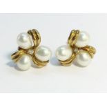 A pair of cultured pearl ear studs set in 9ct yellow gold.