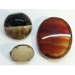 Three 19th century Scottish brooches, two with banded agate,