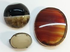 Three 19th century Scottish brooches, two with banded agate,