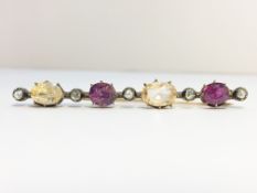 An Antique Diamond, Amethyst and Yellow Sapphire Brooch set in 9ct gold.