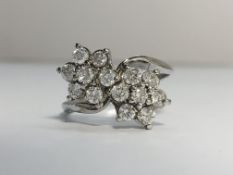 A Double Floral Diamond Cluster Ring in 18ct white gold. Diamonds ETCW 0.70 ct.