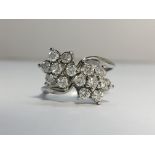 A Double Floral Diamond Cluster Ring in 18ct white gold. Diamonds ETCW 0.70 ct.