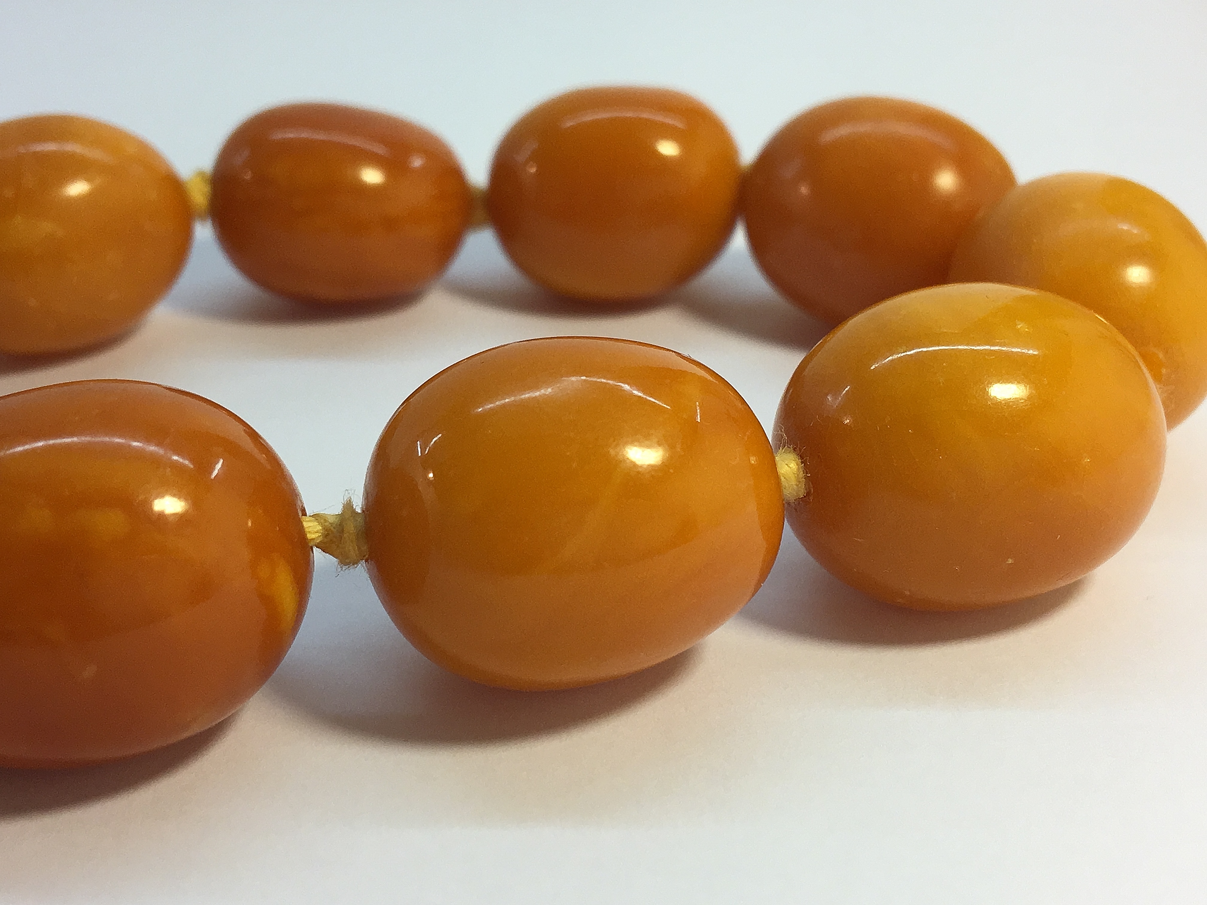 A string of butterscotch amber beads, approximately 18" in length. - Image 6 of 6