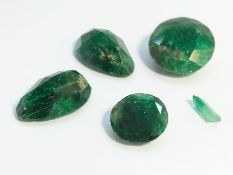 Five loose emeralds, one 8 ct round cut, one 3.1 ct round cut, one 6.7 ct pear shape, one 6.