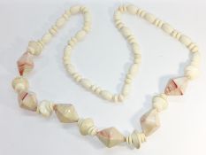 A Rhodochrosite hardstone bead necklace, the large faceted Rhodochrosite beads each measure 4cm,