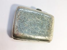 A Chased silver Ladies Cigarette Case, hallmarked Birmingham 1905. Total weight 65.17 grams.