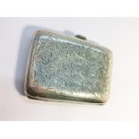 A Chased silver Ladies Cigarette Case, hallmarked Birmingham 1905. Total weight 65.17 grams.