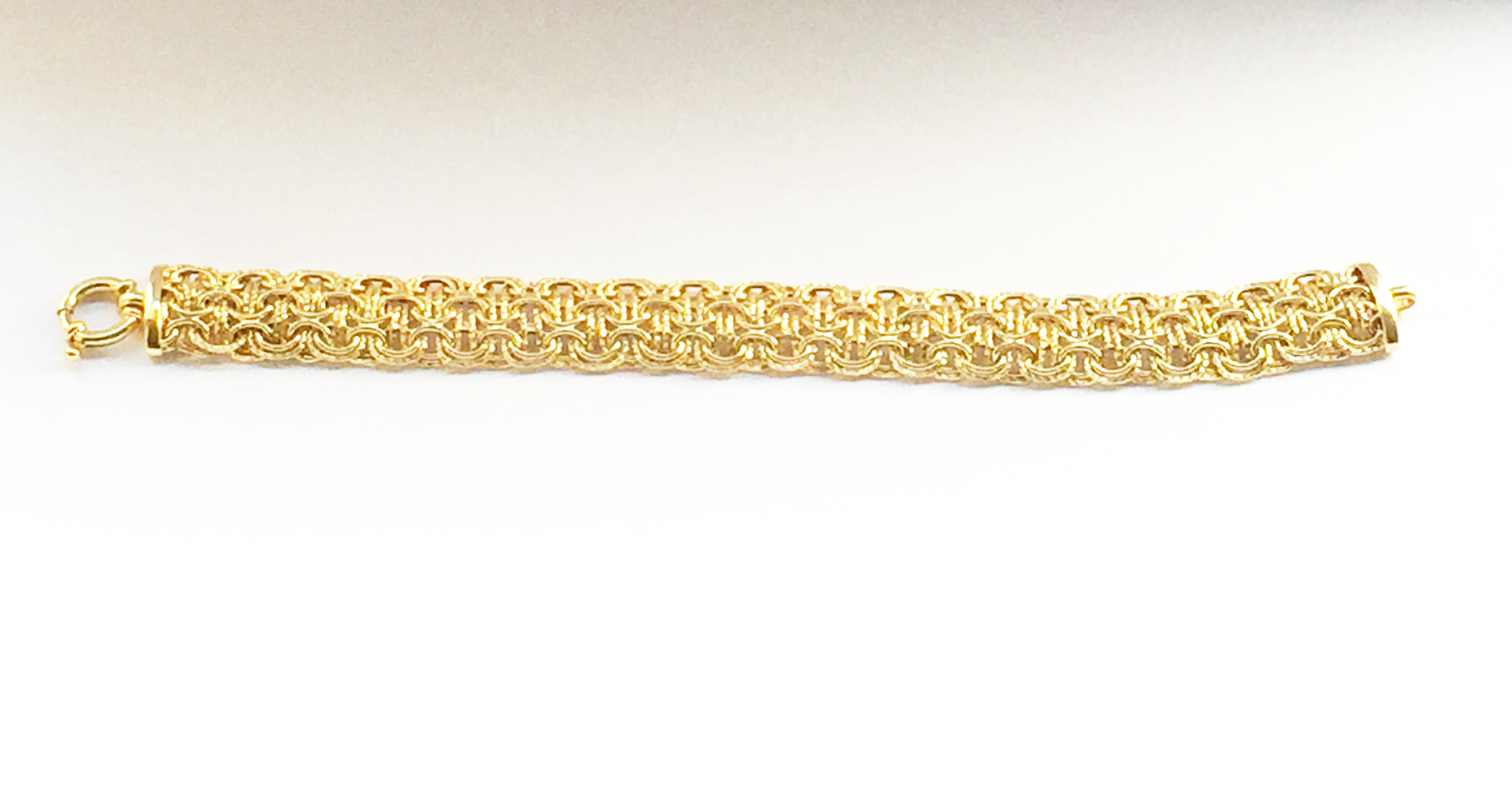 A Contemporary Italian Woven Bracelet by Milros in 14 ct Yellow Gold. With bolt ring clasp closure. - Image 3 of 3