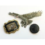 A Victorian memorial brooch with onyx and hair set panel,