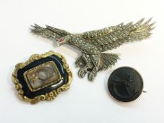 A Victorian memorial brooch with onyx and hair set panel,