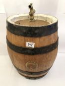 A whisky barrel with white border and tap.