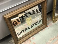A Guinness Extra Stout advertising mirror.