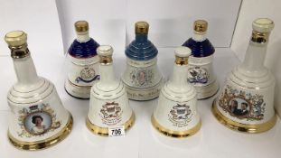 A collection of 7 Royal Commemorative wade whisky bells (sealed and with contents)
