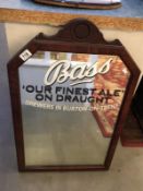 A bass draught ale advertising mirror in frame