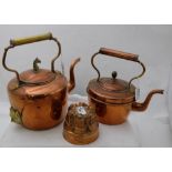 2 Copper Kettles (1 with horse head finial) & a copper jelly mould (3)