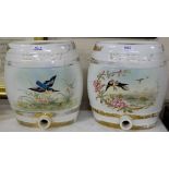 Pair of Porcelain oval-shaped whiskey barrels, painted with wild birds, each 13.5”h