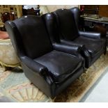 Matching Pair of Brown Leather Wingback Armchairs, on cream painted sabre legs