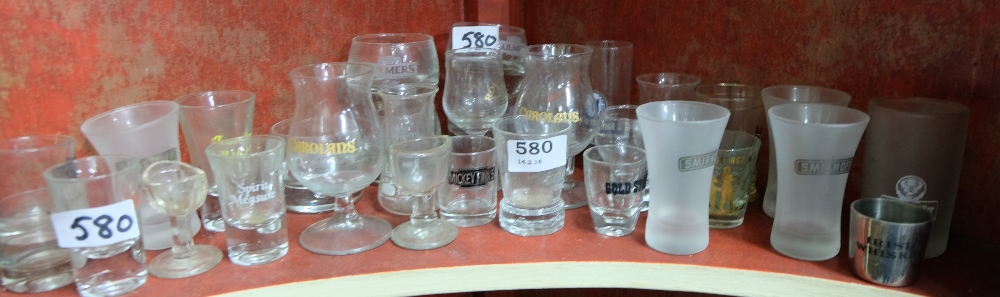 Shelf of bar shot glasses – Carolans, Smirnoff etc & a small box of coloured chemist bottles