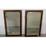 Matching Pair of fine Rosewood Framed Wall Mirrors, the shaped bevelled interior bordered with brass