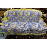 Carved gilt wood decorative 3-seater sofa, covered with blue floral fabric, on 4 front cabriole