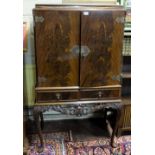 1940’s Flame Mahogany Drinks Cabinet, on Queen Ann legs, the two central doors opening a satinwood