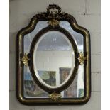 Ornate Gilt framed mirror – a floral swag finial over an oval mirror insert bordered by a gold and