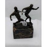 Bronze Group – “Footballers”, on a black marbleized base, 10”h x 5”w