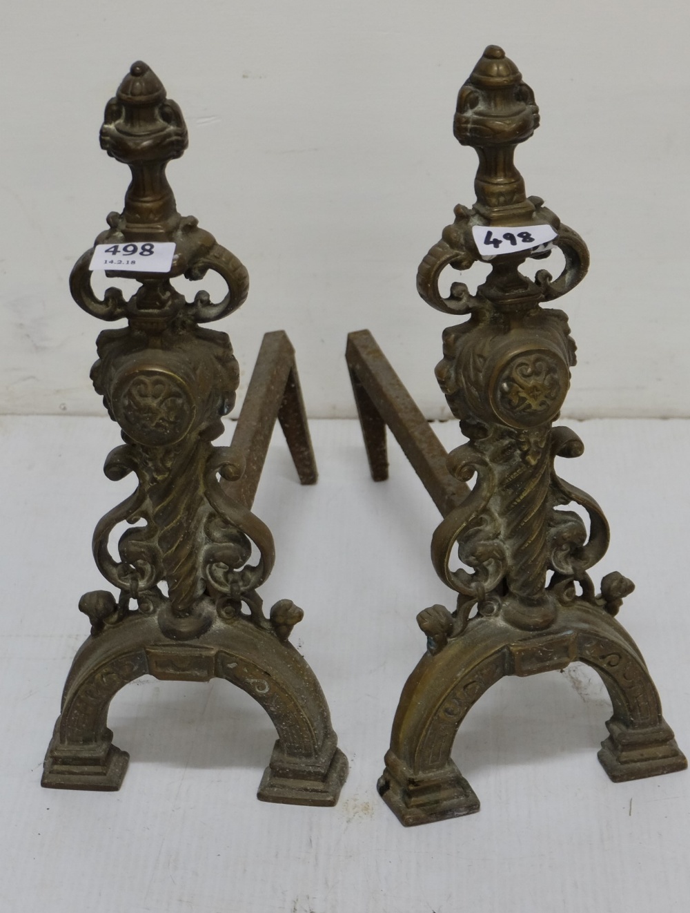 Matching Pair of decorative Brass Fire Dogs, with cast iron supports, each 15”h