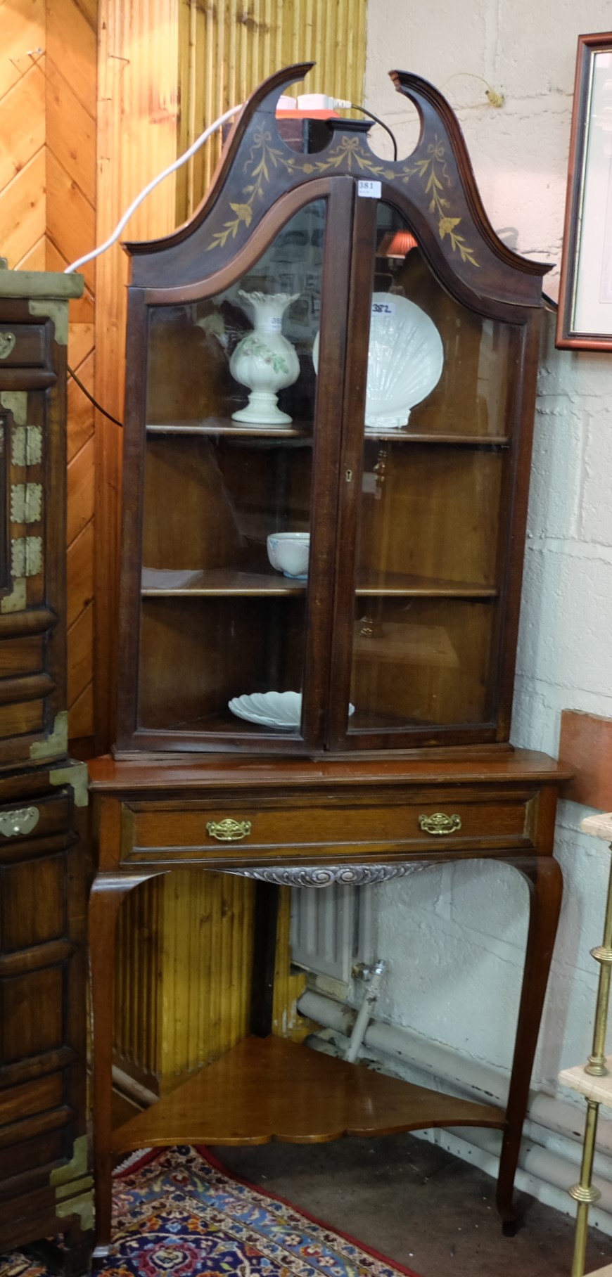 Edw. Inlaid Mahogany Corner Cabinet, with a swan neck p over two glass doors and a drawer and