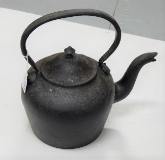 Old cast iron kettle, painted black