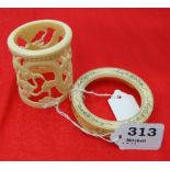 Carved ivory ornament, in the form of dragon figures, 3”h & a decorative circular bone stand (2)