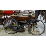 Two old Bicycles – 1 Triumph with a Brooks seat, both with carbide lamps