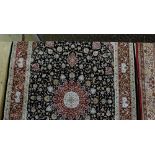 Black ground woven silk carpet with a medallion design and red border 2.9m x 2m