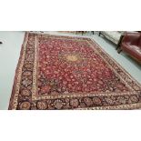 Rich red ground Persian Mashad Carpet, floral medallion design, and signature of the weaver, 4.4m