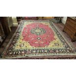 Old red ground Persian Tabriz Carpet, with a floral medallion design, vibrant colours, 3.52 x 2.46m