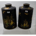 Matching Pair of circular Tea Urns, black ground and decorated with Chinese figures in yellow dress,