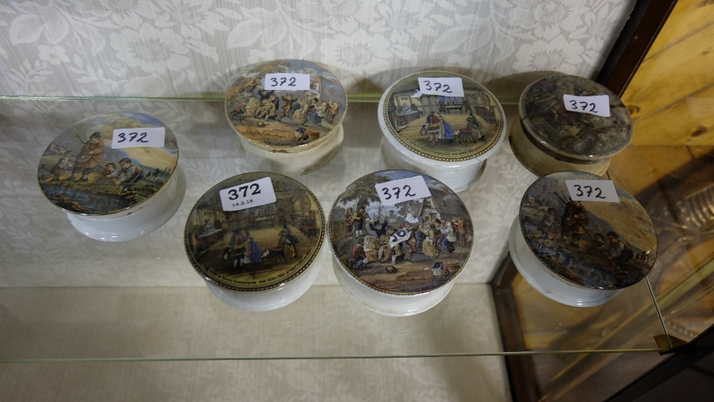 7 paste jars with decorative pot lids – 2 x Village Wedding, 2 x Shakespeare, fishing scene etc