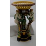 Majolica Table Centrepiece, the fluted upper bowl supported by 3 cherubs decorated with green swags,