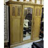 Large Edwardian Walnut 3 Door Wardrobe - 1 with mirrored glass, 2 with carved panels, enclosing