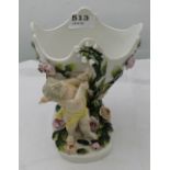 Dresden pot pourri bowl, supported by a cupid figure, raised floral detail, 7”h