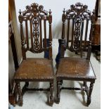 Matching Pair of Carved Oak Hall Chairs, Jacobean style, lion pediments