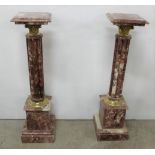 Matching Pair of Red Marble rcheres with brass Corinthian column detail, 39”h x 10” sq p