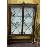 Edwardian Mahogany Display Cabinet with 3 plate glass shelves and cream satin covered, on tapered