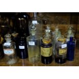 Large collection of glass apothecary bottles, clear glass, brown and blue